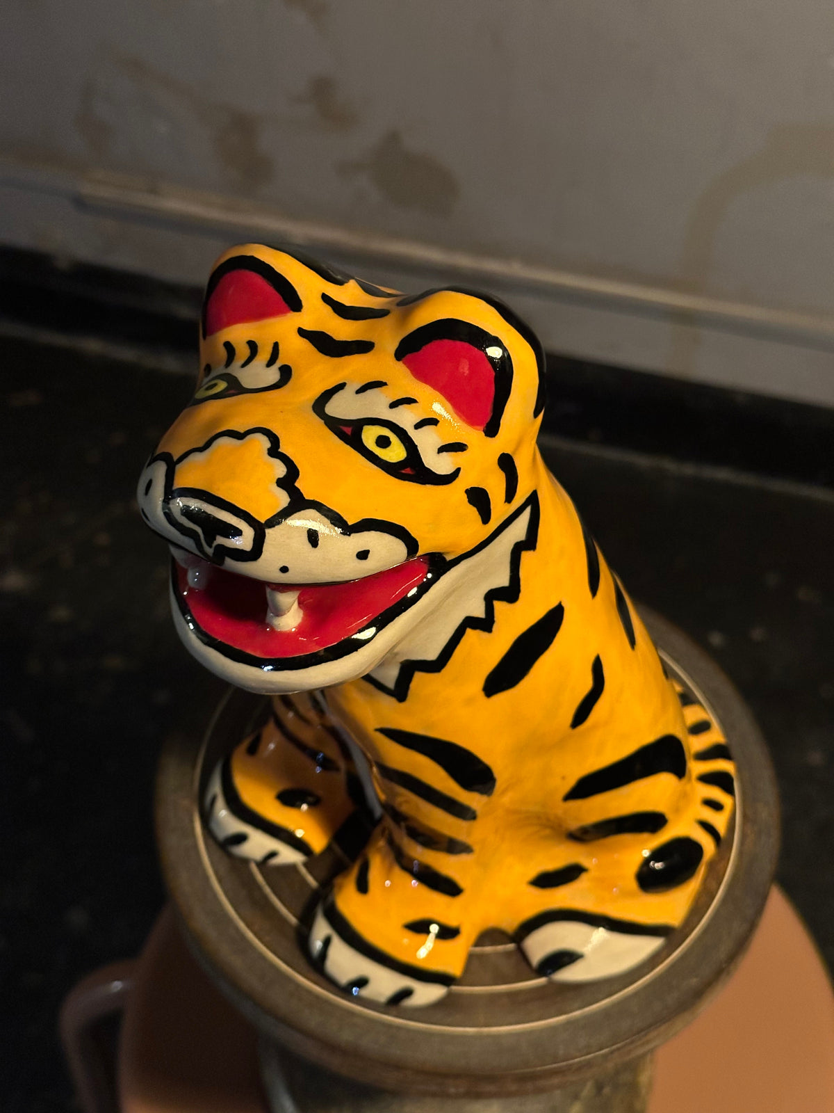 Yellow and black stoneware tiger by Julia Staflund